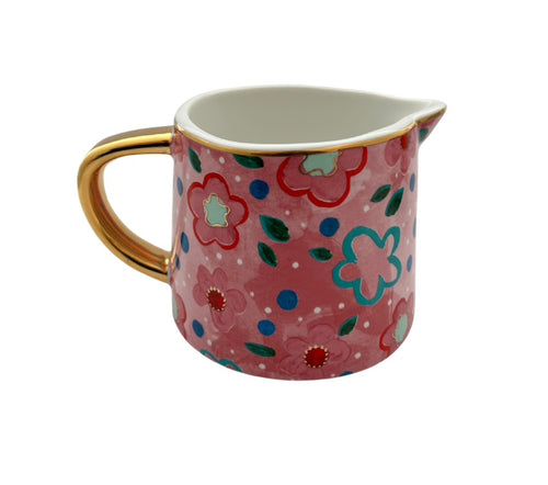 Pink ceramic milk jug flowers 